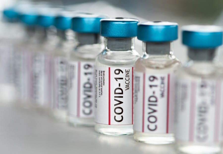 Will 246 million Americans have received at least one dose of an approved Covid-19 vaccination by January 1, 2022?