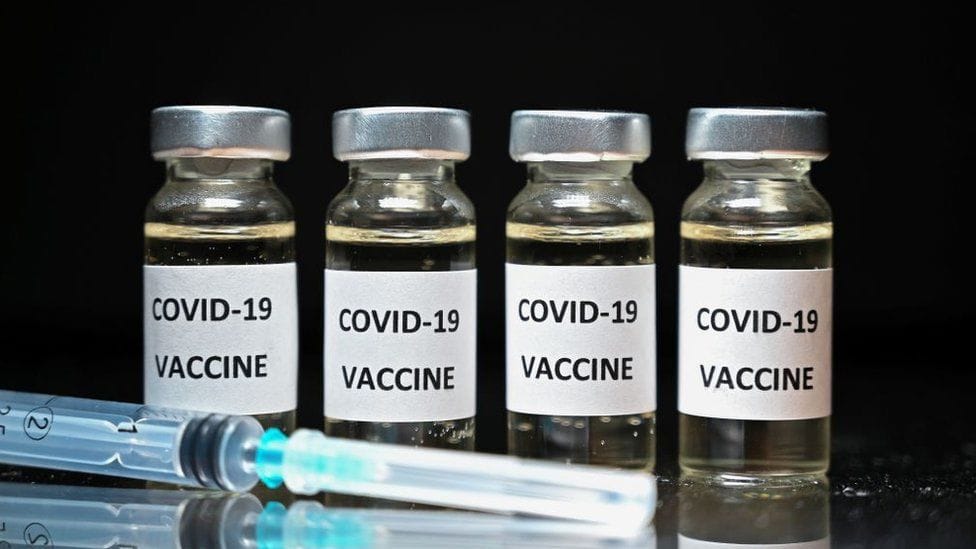 Will 248 million Americans have received at least one dose of an approved Covid-19 vaccination by January 1, 2022?